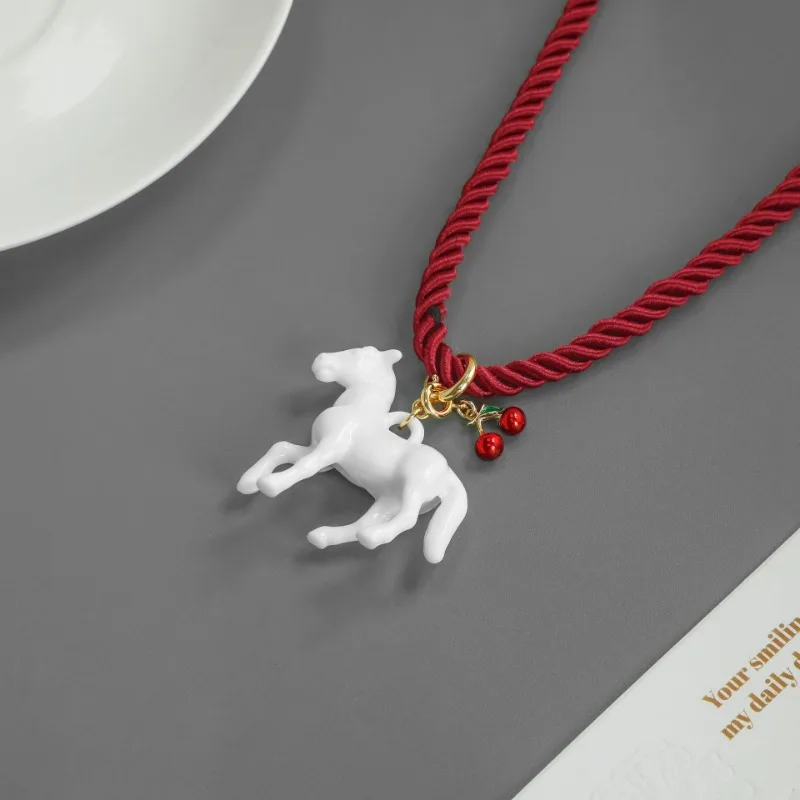 2025 New Arrival Autumn Winter Style Cute Small White Horse Charm Red Rope Necklace Simple Niche Design Personalized Resin Chain
