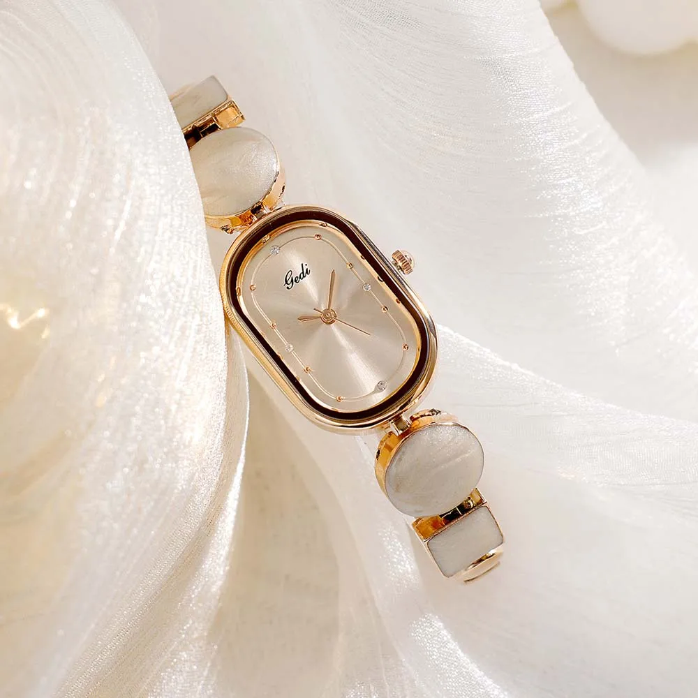ساعة كوارتز نسائية من GEDI بسوار بيضاوي رائع وبسيط مع تصميم فريد من نوعه غير منتظم وفني ساعة كوارتز للسيدات