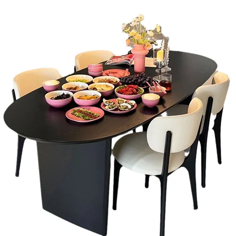 

Nordic medieval wabi-sabi wind black solid wood dining table small apartment oval table log negotiation table master design