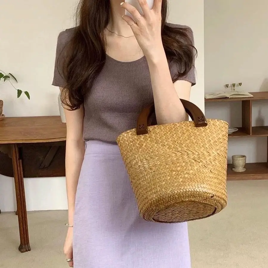 New Handmade Woven Hollowed Out Large Capacity Bucket Type Women's Handbag New Summer Seaside Vacation Straw Woven Bag For Women