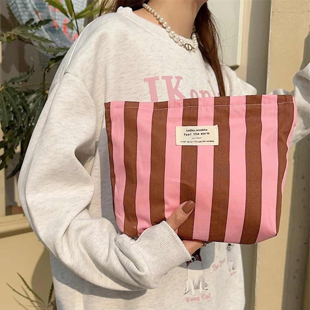 A Patchwork Striped Cosmetic Bag with Zipper for Travel and Storage