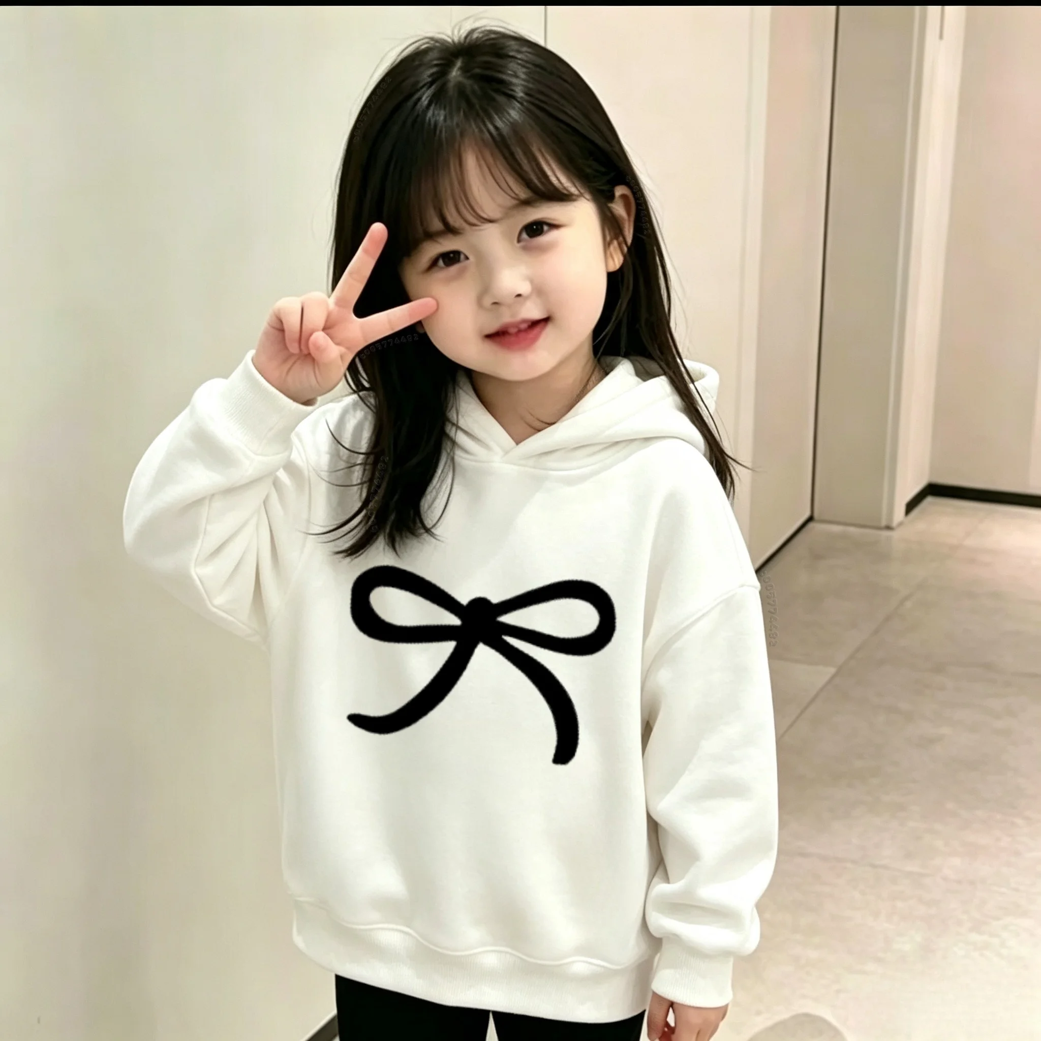 Latest model - Children's casual warm hooded sweater. Boys' and girls' fashionable bow-print pullover hoodie.