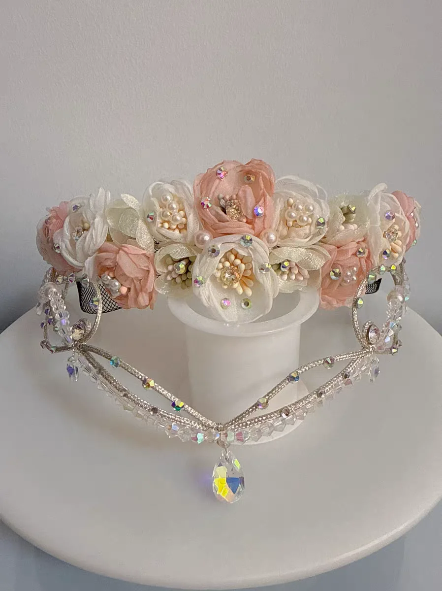 

Two pieces of a ballet Cupid crown necklace that can be customized and changed in color.