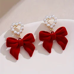 1 pair of plush bow shaped heart-shaped imitation pearl earrings, French retro light luxury Christmas earrings.