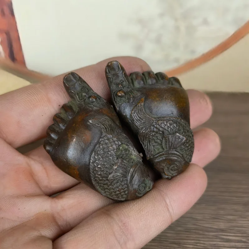 A pair of decorative ornaments for home use, solid paperweights with the message 'May there be and abundance every yea