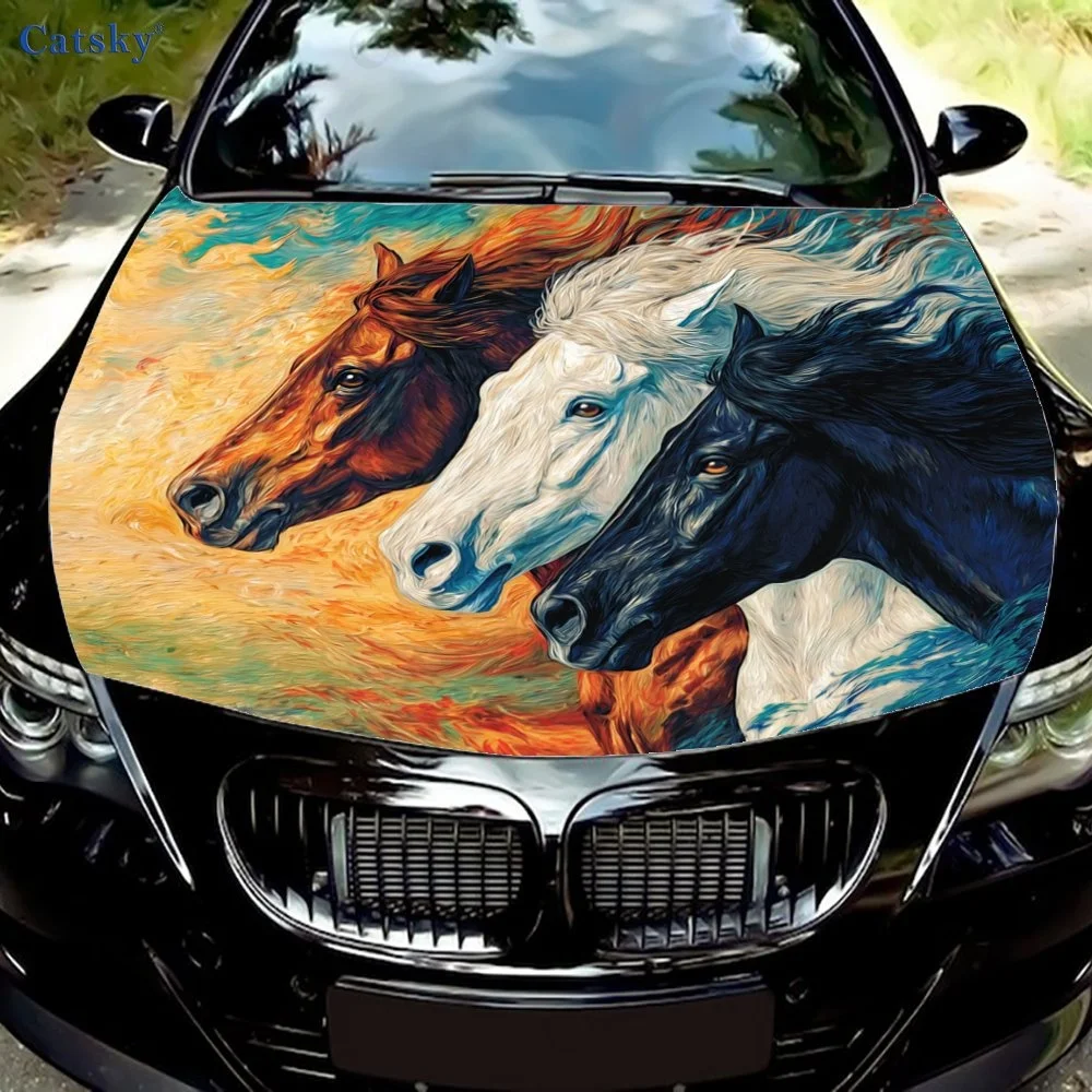 Vibrant car hood wrap featuring three galloping horses in brown, white, and black, set against a dynamic, colorful background.Ho