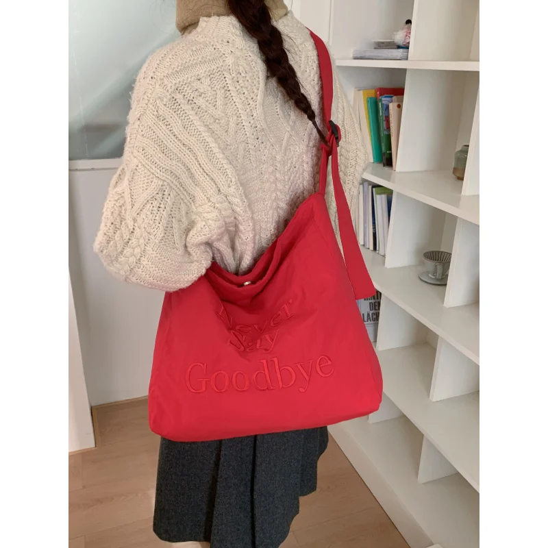 

Korean-style letter-embroidered nylon tote bag for women, new model, large capacity, niche design Versatile shoulder bag for com