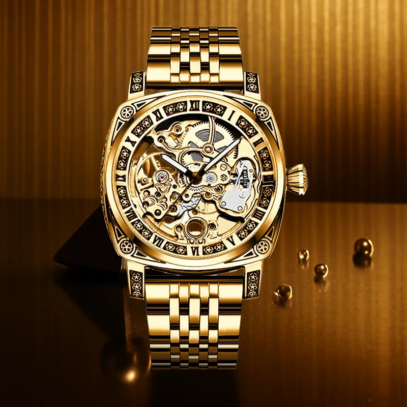

A men's gold-toned steel strap business vintage engraved engraved analogue automatic mechanical watch