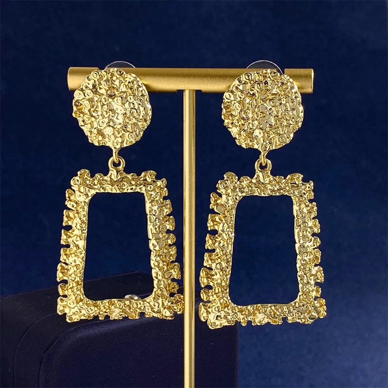 

Metal wind earrings with hollow trapezoidal design, irregular texture relief, geometric circular earrings