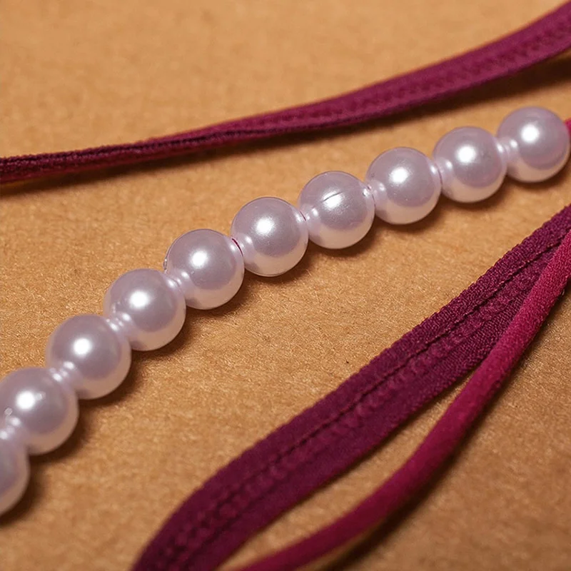 WAKEWAY المرأة مثير مطرز ندف ملف مفتوح الملابس الداخلية مثير فراشة الملابس الداخلية الترتر تدليك T على شكل ثونغ