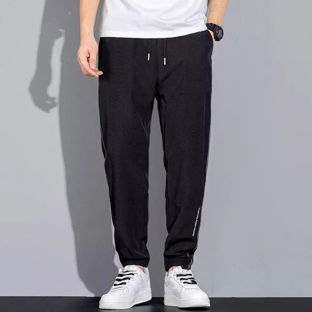 

Men Sports Pants Drawstring Ice Silk Loose Ankle-banded Cargo Pants Solid Color Quick Dry Pockets Sweatpants pantalones hombre