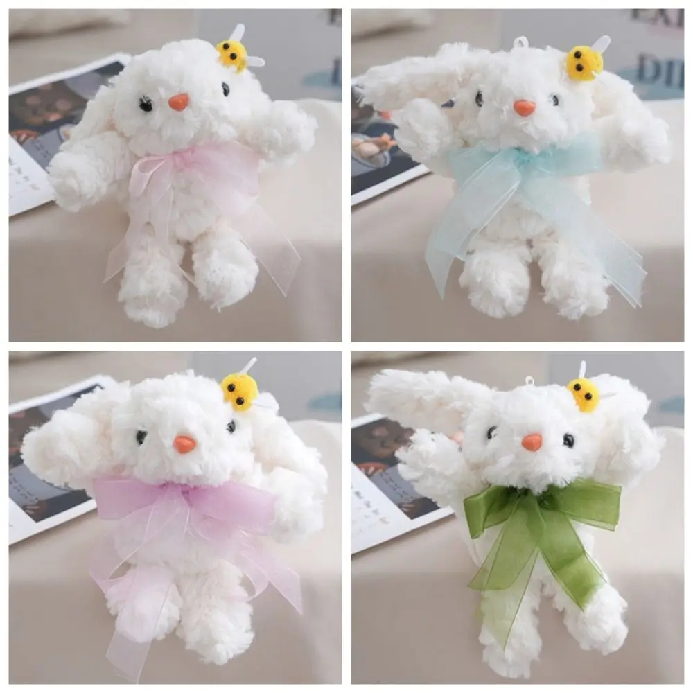 ตุ๊กตากระต่ายขนนุ่มแบบใหม่ กระเป๋าตุ๊กตาการ์ตูนผูกโบว์ ของเล่นตุ๊กตาแบบมีพวงกุญแจ ของขวัญ ห้อยตกแต่งหูห้อย