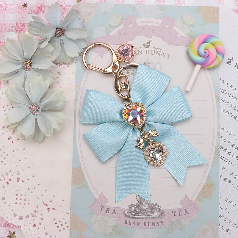 Porte-clés pendentif nœud papillon ruban pour filles, perles de nœud doux Kawaii, porte-clés perlé, sac Girly, breloque pour sac à dos