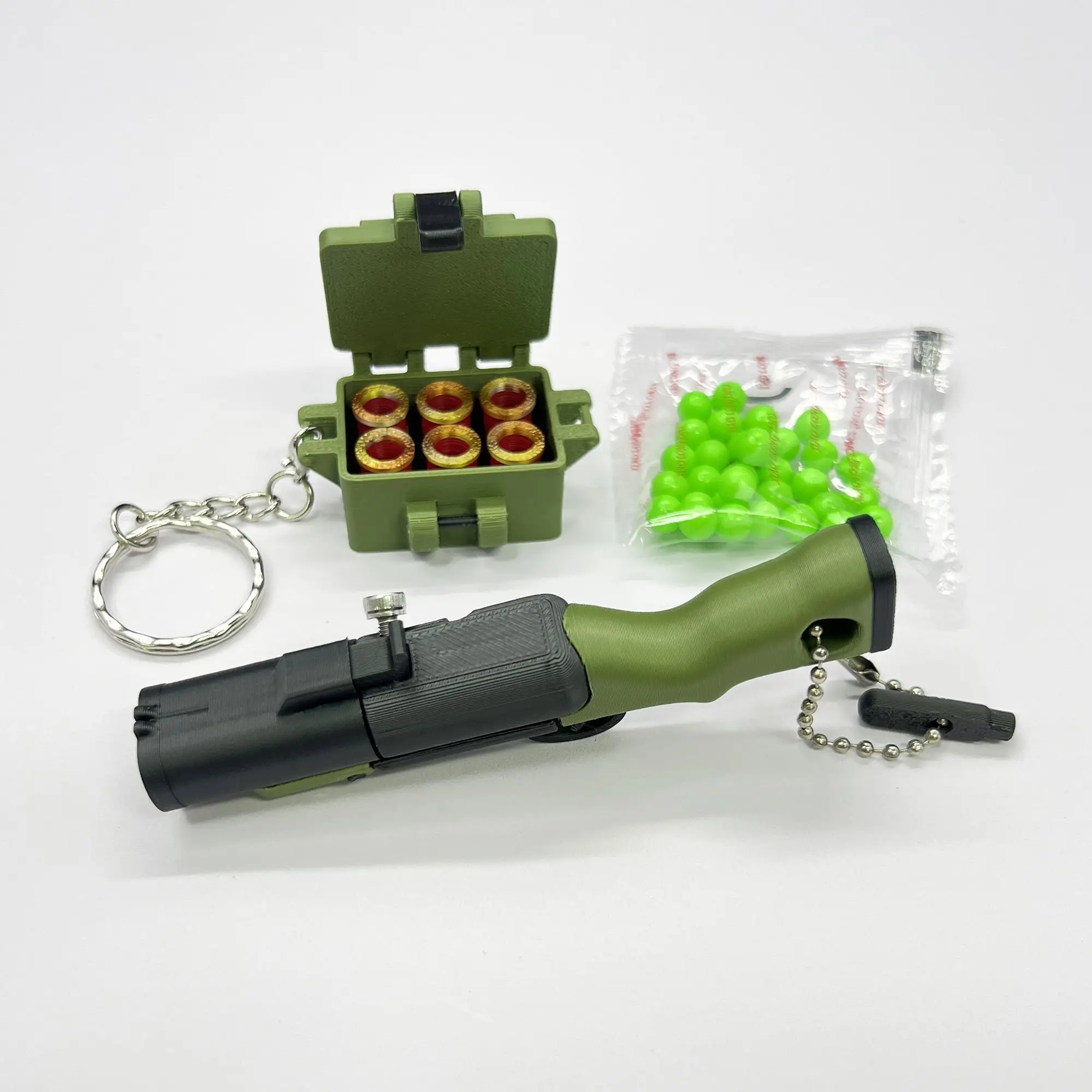 

Hot Selling New 3D Printed Mini M79 Finger Launcher Fidget Stress Relief Toy Keychain Shooting Pendant Novelty Gift for All Ages