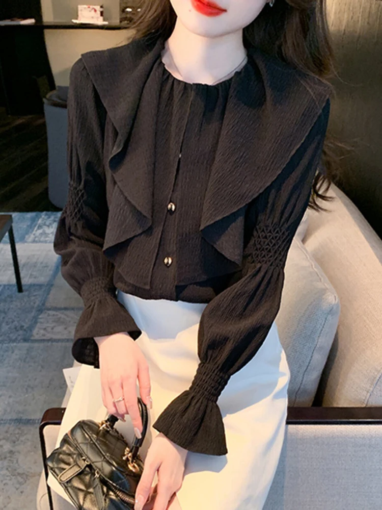

Spring new solid color long sleeved ruffled shirt women's temperament round neck elegant design sense single-breasted top