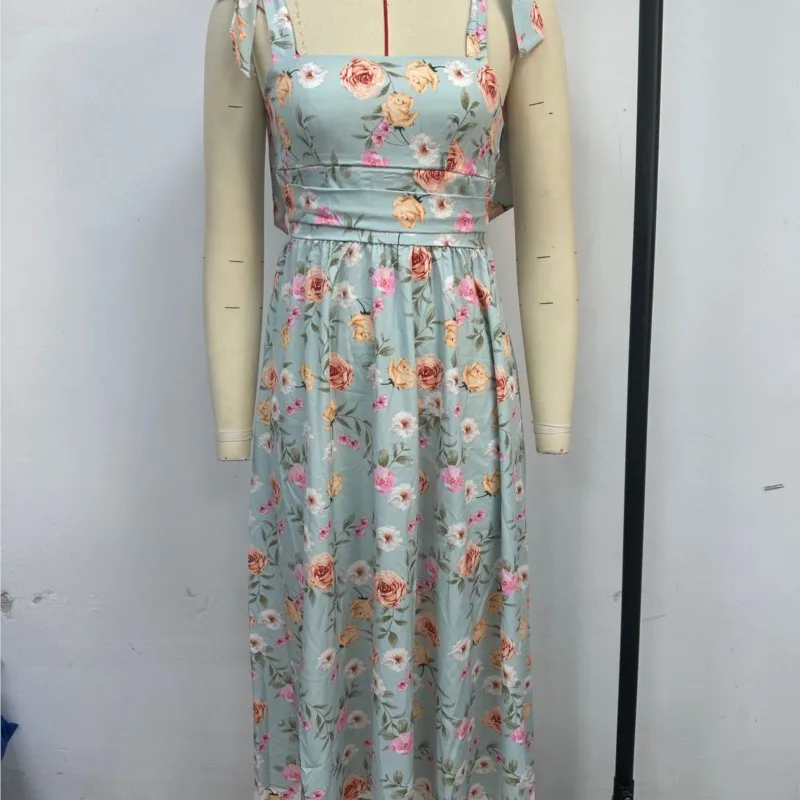 夏エレガントなノースリーブフラワープリントドレス弓サスペンダースクエアカラーハイウエストルーズ中空オフショルダービーチロングドレス