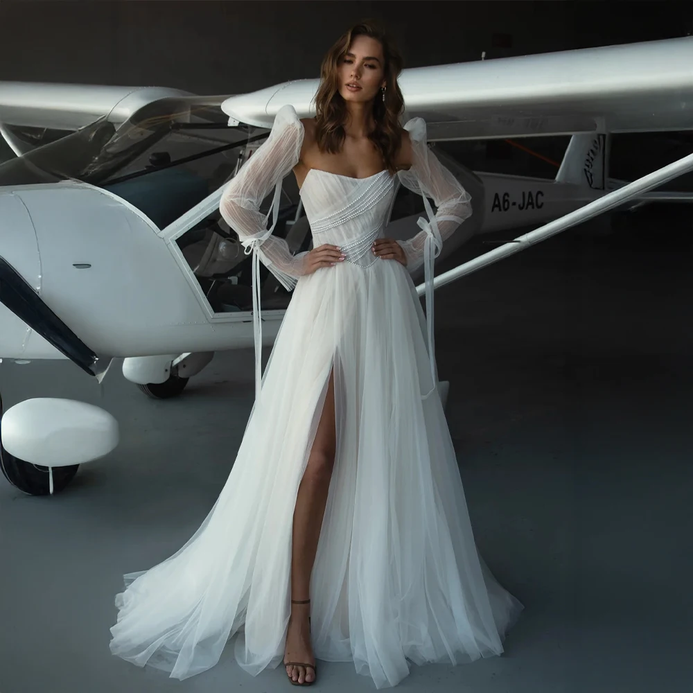 فستان زفاف مخصص على شكل قلب بدون أكتاف مع لمسات لؤلؤية وقطار متدفق فستان زفاف فاخر للاحتفالات الحديثة