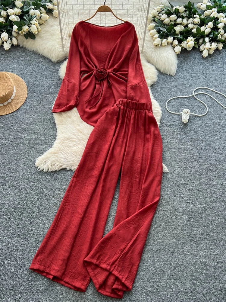 

Антивозрастной комплект: топ с цветочным принтом и завязками на талии, брюки с высокой талией и широкими штанинами, женский модный комплект для весны и лета, повседневный рабочий костюм.