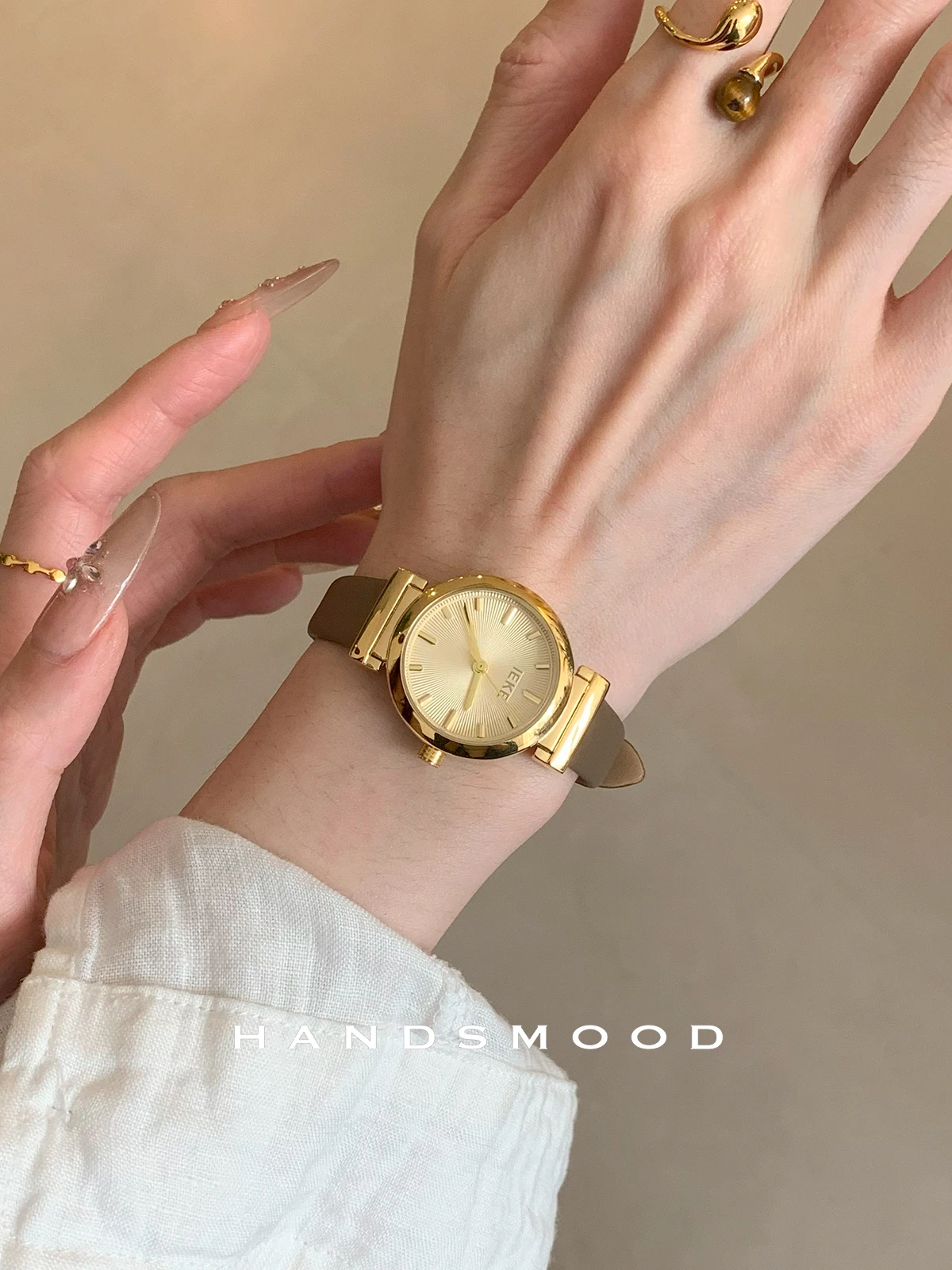 

New stylish and sophisticated round leather watch for women, understated and versatile, a women's wristwatch and accessory.