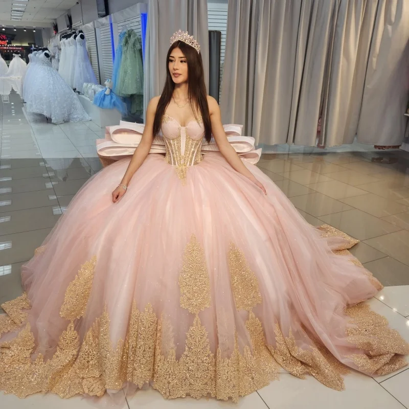 

Shiny light pink Quinceanera Dress Crystal Golden Glitter flower Decal Long tail Big Bow Vestidos De 15 Quinceanera ﻿Customize