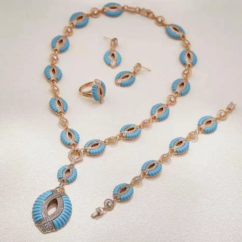 

Набор украшений: кольцо, серьги, браслет, ожерелье с кубическим цирконием, розовым перламутром, малахитом и бирюзой.