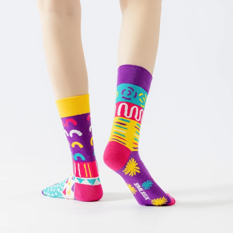 1 pair of women’s asymmetrical knee-high socks with an abstract geometric print, size 35–40