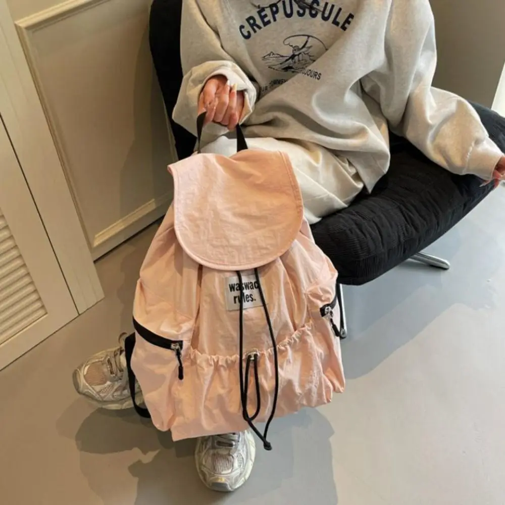 กระเป๋าเป้สะพายหลังแบบมีเชือกผูกสีพื้นสไตล์เกาหลี ทำจากไนลอน น้ำหนักเบา กระเป๋าสะพายไหล่แบบรูด จุของได้เยอะ เหมาะสำหรับนักเรียน นักศึกษา ใช้ได้ทั้งชายและหญิง