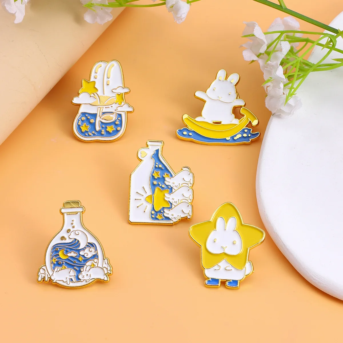 Cartoon cute bunny carrying stars wishing bottle Naughty bunny playing banana skateboard on the water creative brooch