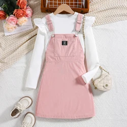 Spring/Autumn girls' trendsetting white flared sleeve top pink suspender pleated skirt set.