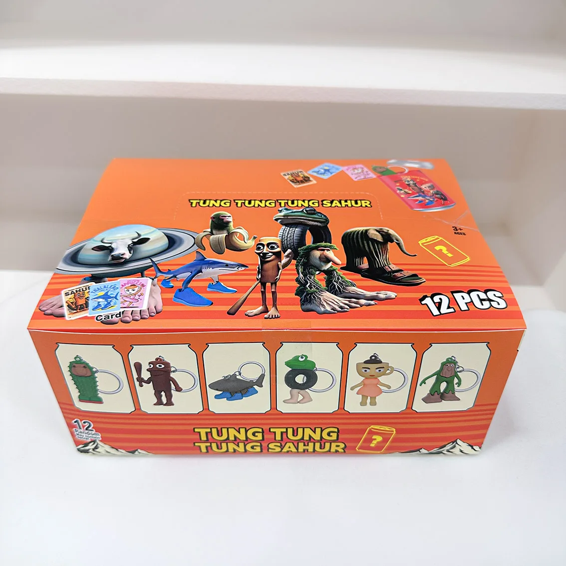 

12-piece set of Shan Hai Jing abstract keychain aluminum can blind box funny wooden stick big foot tree shoes shark fun gift
