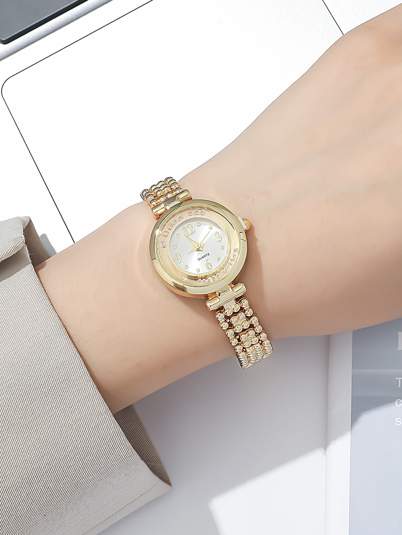 A Gold Women\'s Classic Fashion Quartz Watch With A Ball Bracelet And A Rhinestone Plum Bracelet. Can Be Used For Daily Wear