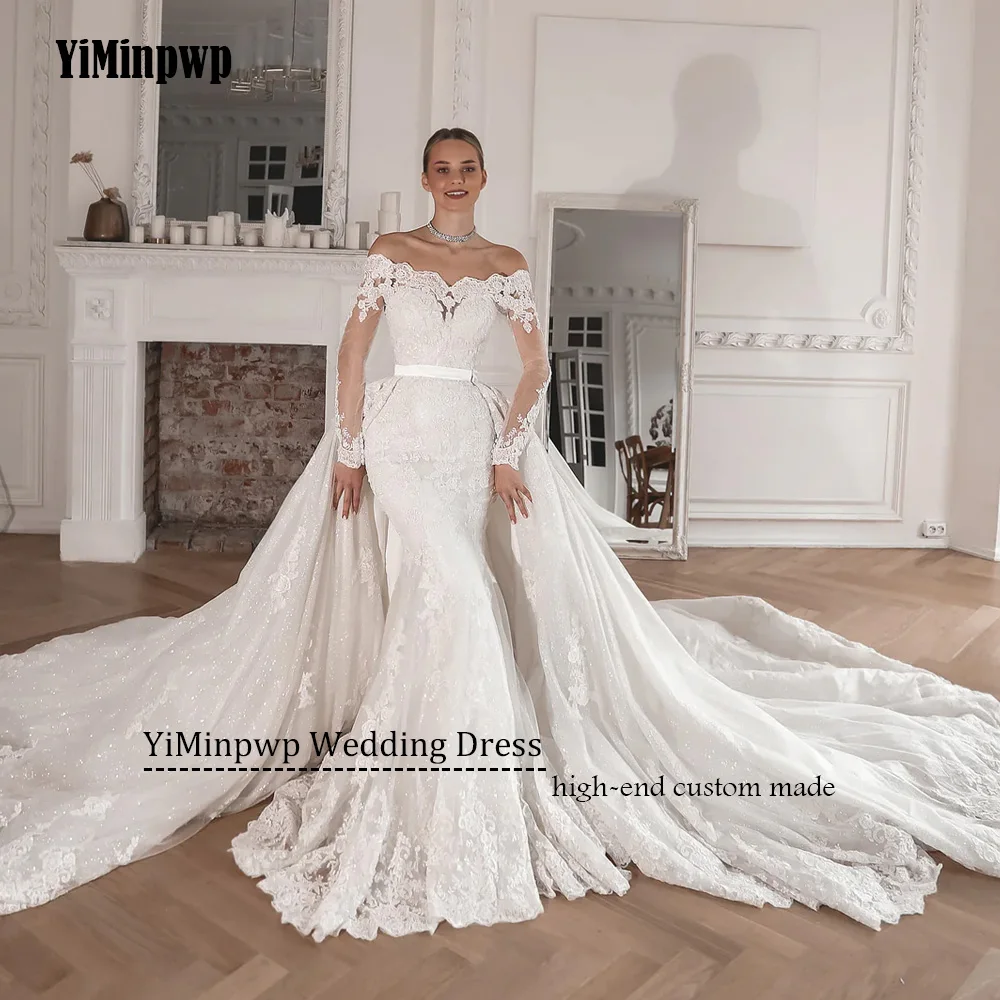 فساتين زفاف متألقة مكشوفة الكتف 2025 فاخرة بأكمام طويلة مزينة بقطار قابل للانفصال حورية البحر دانتيل فساتين العروس حسب الطلب