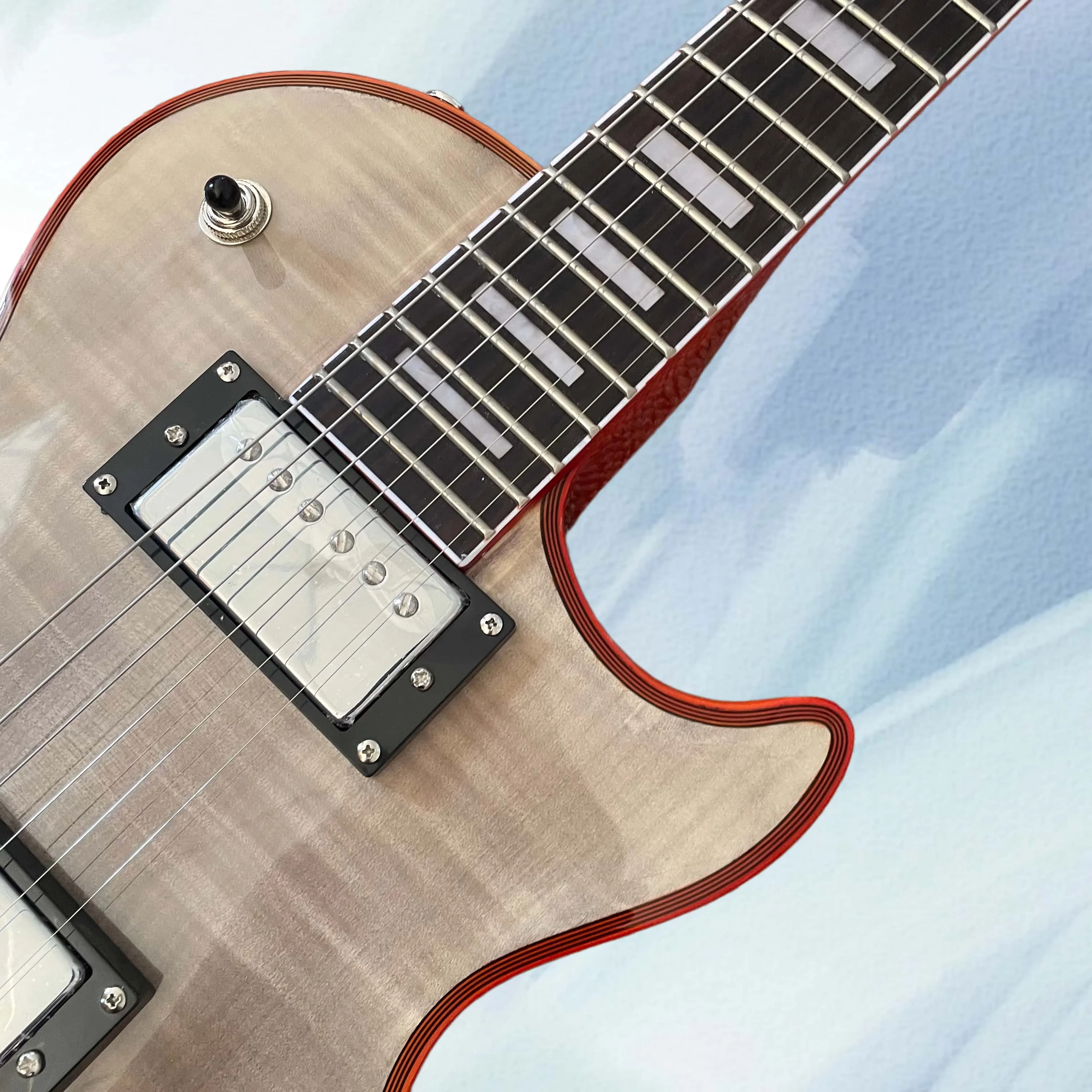 Transparent black electric guitar with red binding, chrome hardware, and a rosewood fingerboard view 3