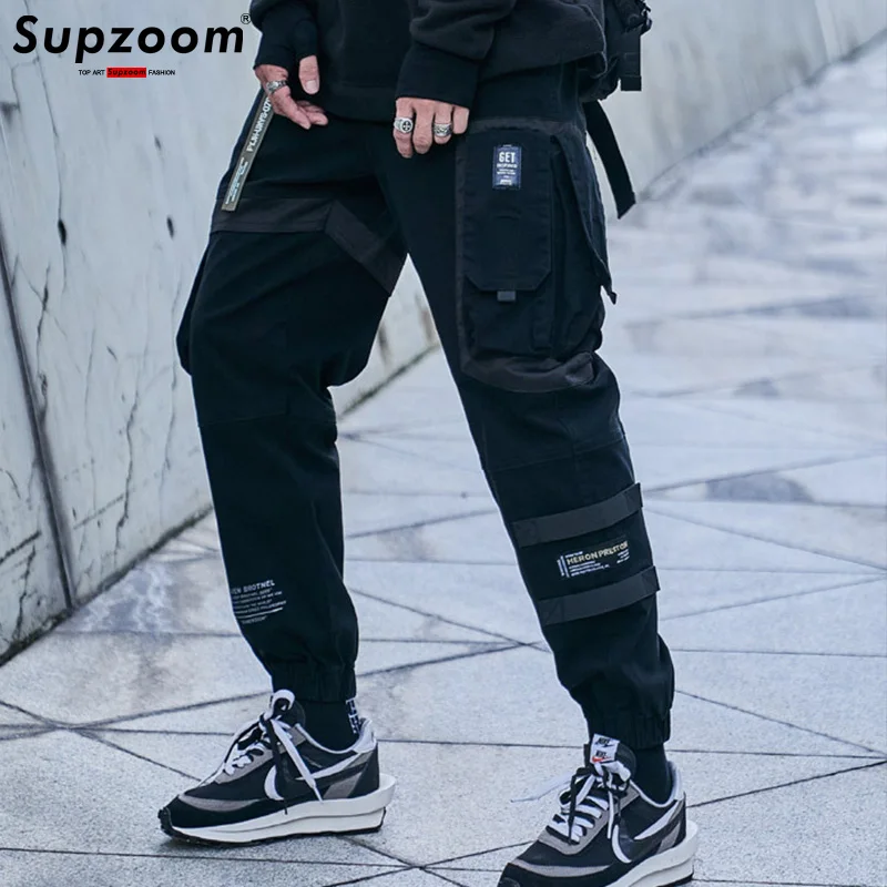 Supzoom 2025, recién llegado, pantalones holgados con cintura elástica y bolsillos de longitud completa, pantalones de ocio con logotipo Popular para hombre, pantalones Cargo de algodón