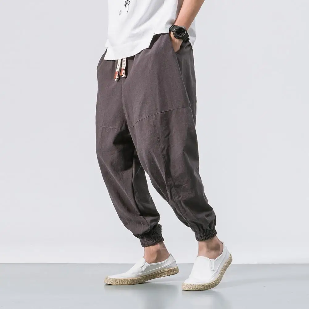 Pantalones bombachos de algodón para hombre, ropa de calle de cintura elástica sólida, estilo japonés, holgados, hasta el tobillo, con bolsillos