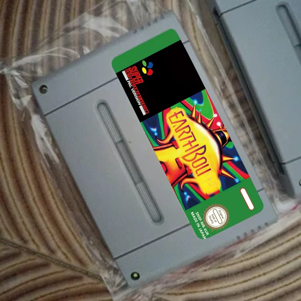 خرطوشة RPG Game Earthbounded 16 بت USA/EUR/JAP الإنجليزية الإسبانية والفرنسية والألمانية المتاحة لوحدات تحكم ألعاب الفيديو SNES