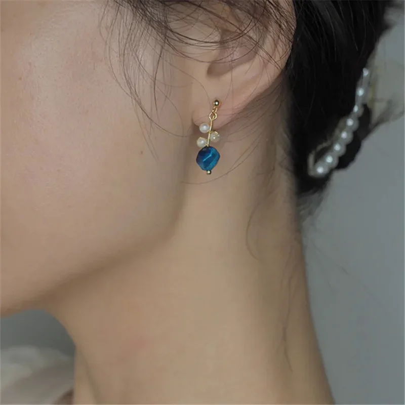 Anting-anting Pesta indah wanita anting-anting indah romantis klip telinga mutiara alami batu mata harimau biru buatan tangan desain asli