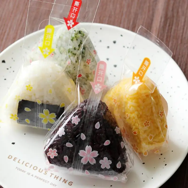 Bolsa de bola de arroz triangular de 100 piezas, Sakura Panda, antivaho, fácil de rasgar, embalaje de bola de arroz de Sushi, se puede calentar, embalaje de Sushi