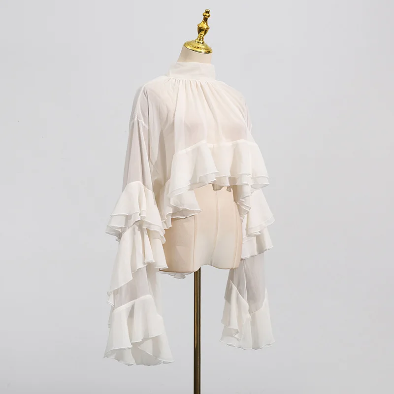 New style of the fashion season - elegant and stylish netted sleeveless top with wooden earflaps and long sleeves