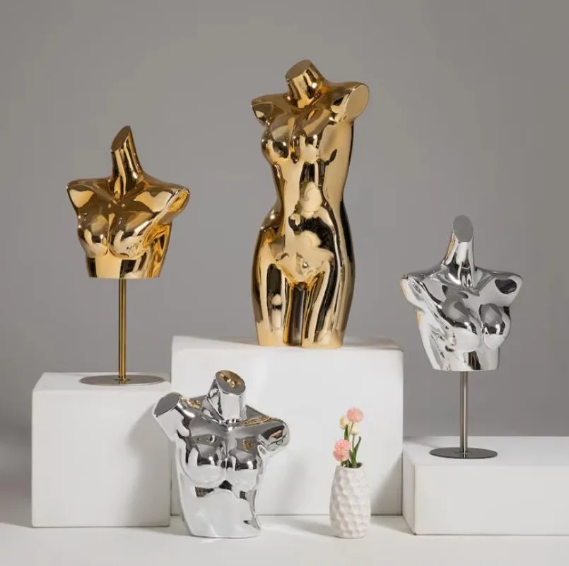 Custom shiny gold mannequins for clothing window displays