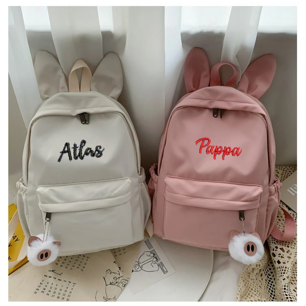 Mochila de orelhas de coelho personalizada e simples, tecido de nylon, nome bordado personalizado, bolsa de estudante masculina e feminina, nova moda