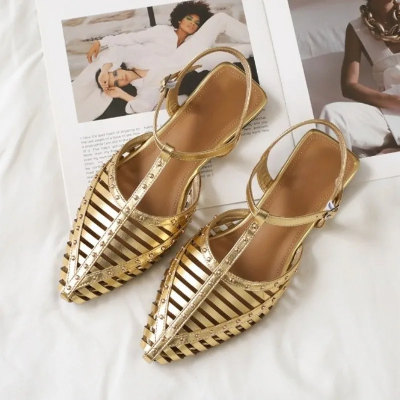 

Retro Rivet Hollow Out Roman Sandals for Women 2026 Summer T-strap Design Pointed Toe Big Size Flat with Female Beach Shoes