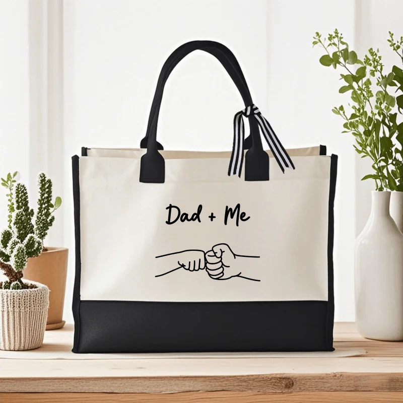 Cream and black canvas tote bag, printed with father and child boxing design, suitable for father and son to go out.