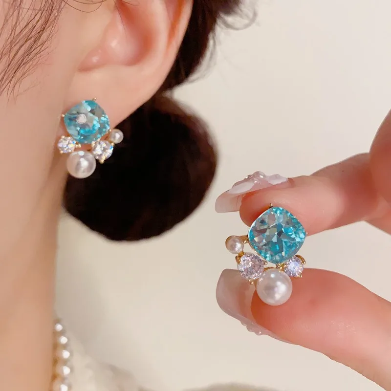

Fashionable light luxury inlaid cubic zirconia imitation pearl earrings S925 silver needle sparkling charm women's earrings