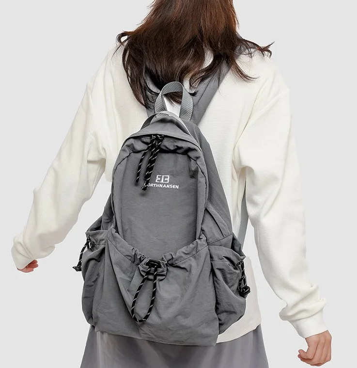 

2025 Лидер продаж, мягкий повседневный рюкзак на воздушной подушке с мягкой ручкой, внешняя рамка, школьные сумки, однотонный нейлоновый рюкзак большой вместимости