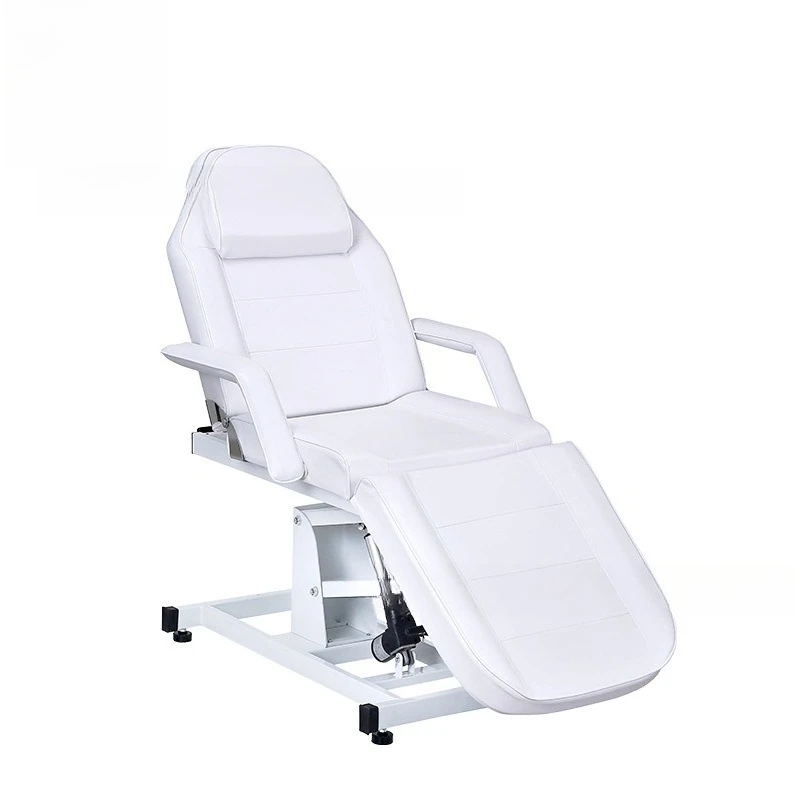 

Электрическая кровать для массажа и косметических процедур, белая, с регулируемым подголовником и подлокотниками.