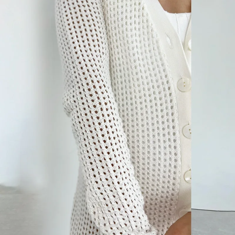 Vestido largo de Crochet ahuecado para mujer, traje Sexy transparente de una sola botonadura para playa, novedad de 2024