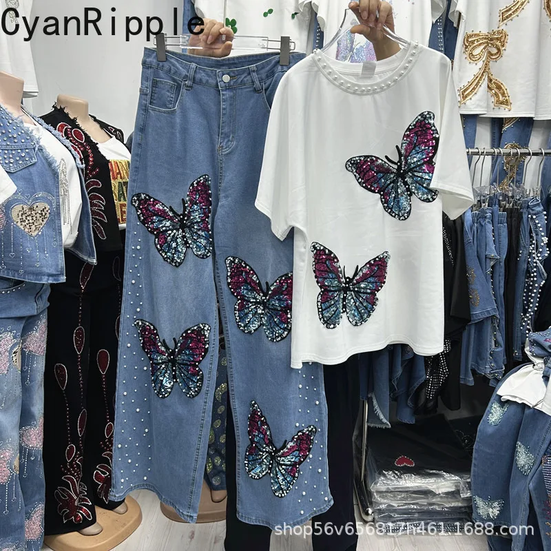 

Модный женский комплект из двух предметов: топ с коротким рукавом и пайетками в виде бабочки + широкие брюки с высокой талией для весны и лета