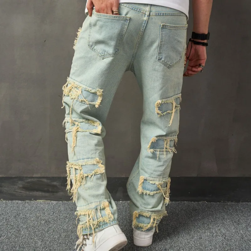 Nuovi pantaloni da uomo casual a gamba larga alla moda con barba sciolta in denim bionico con toppa in tessuto cucito strappato