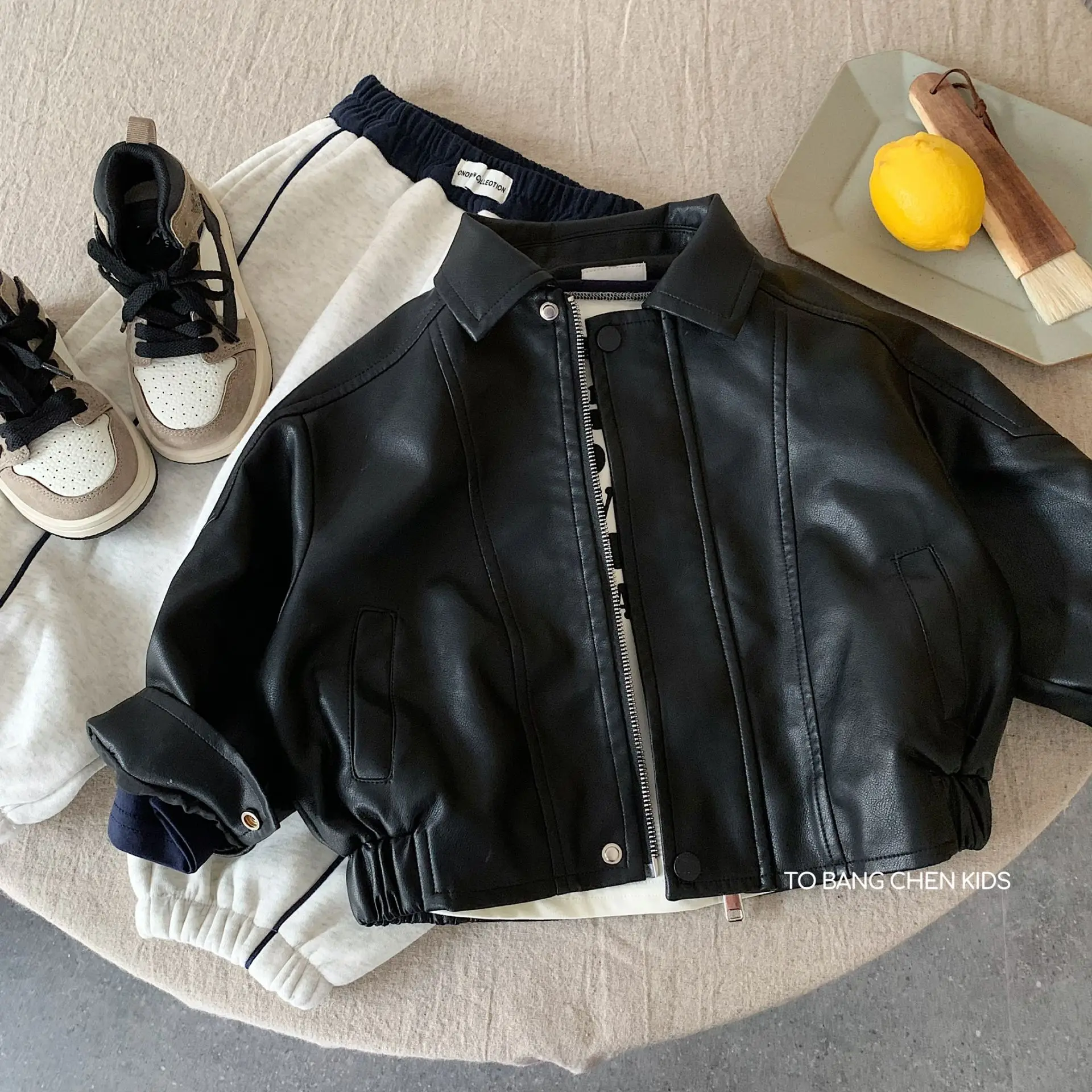 

Children's leather jacket 2026 spring new boys and girls handsome splicing thickened top weaving children's clothing